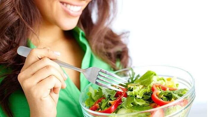 girl eating vegetable salad on a protein diet